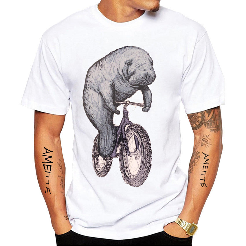 Person wearing a white t-shirt with a graphic of a manatee riding a bicycle.