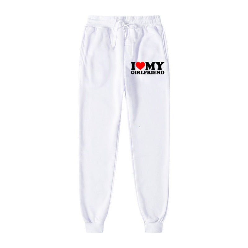 White sweatpants with 'I ❤️ MY GIRLFRIEND' text on a white background