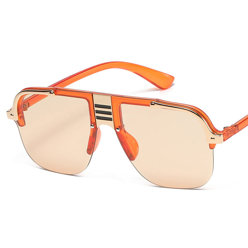 Sunglasses with orange frame and gold-tinted lenses on a white background