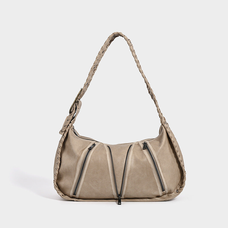 Beige shoulder bag on a white background.
