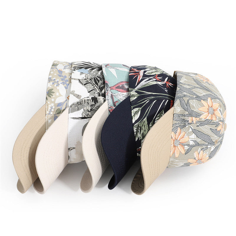Set of five decorative hats with floral and abstract patterns on a white background