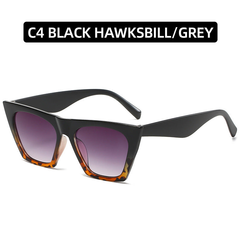 Black sunglasses with purple gradient lenses on a white background