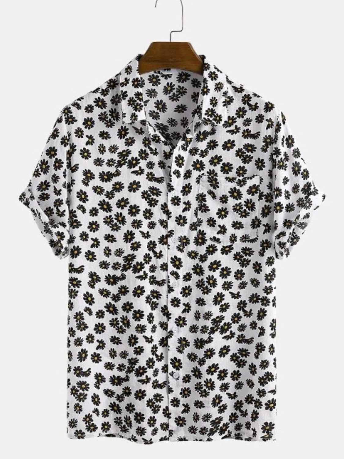 Black floral patterned shirt on a hanger against a white background