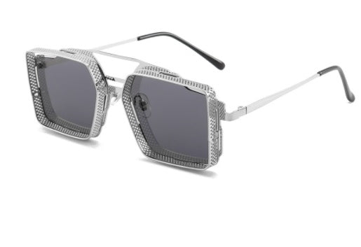 Silver sunglasses with a geometric frame on a white background