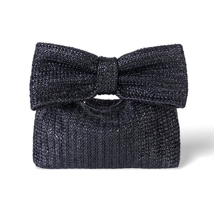Black textured clutch bag with a bow on a white background