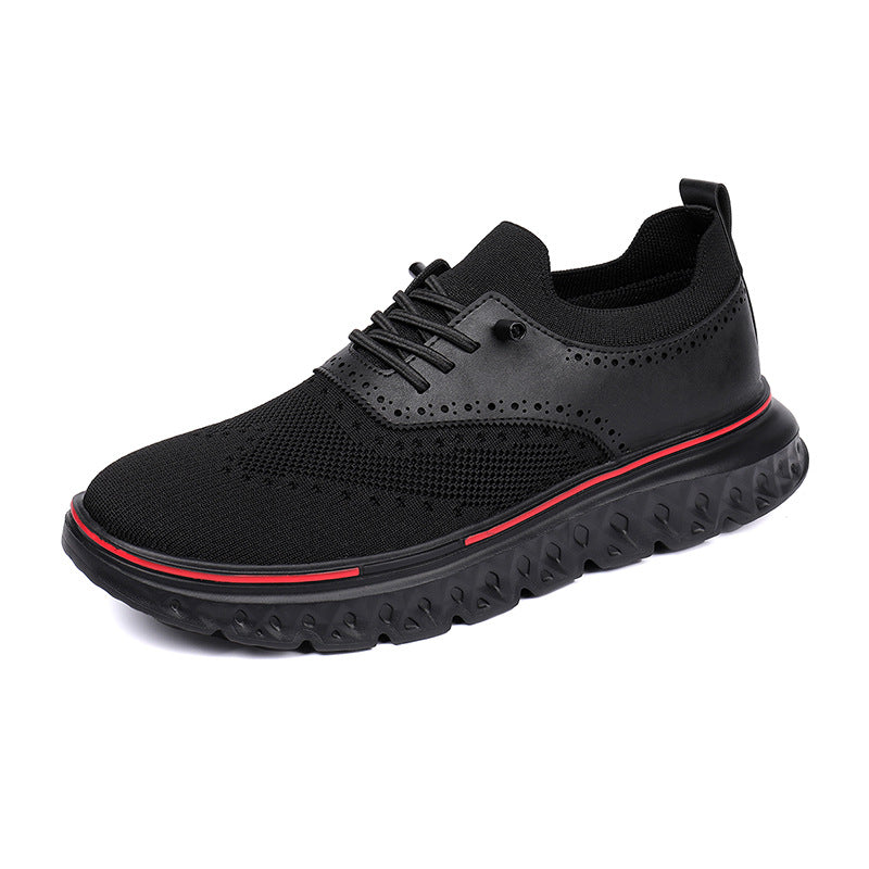 Black athletic shoe with red accent on a white background