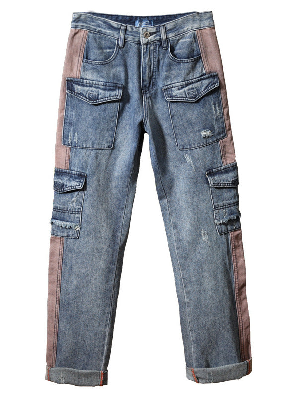 Pair of patchwork jeans with denim and brown fabric on a white background