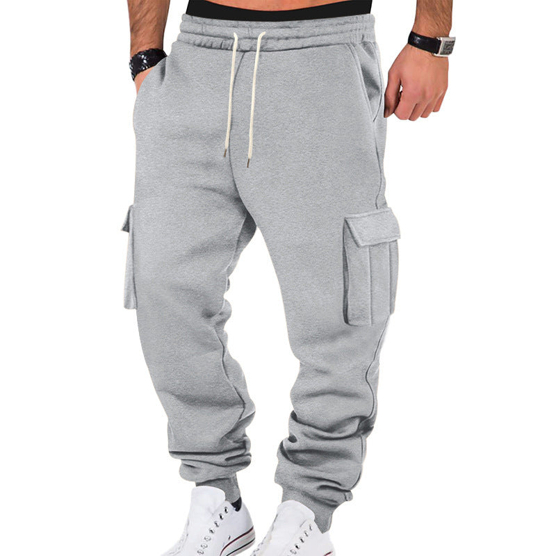 Gray cargo jogger pants worn by a person on a white background