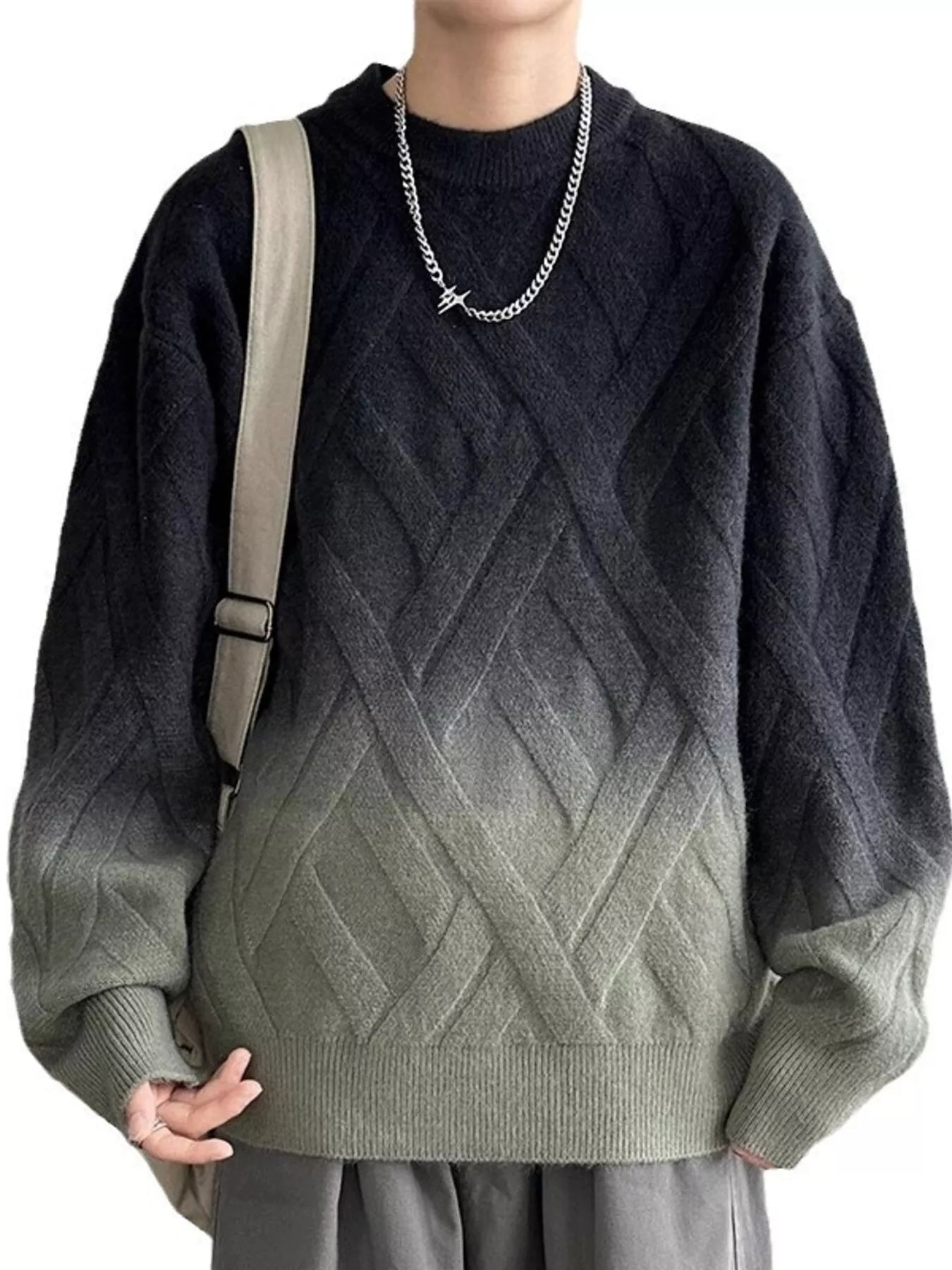 Person wearing a gradient sweater with geometric pattern, holding a beige bag.