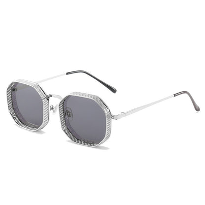 Sunglasses with silver frame and dark lenses on a white background