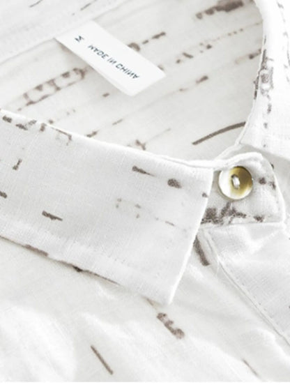White fabric with a subtle pattern and a button, on a white background.