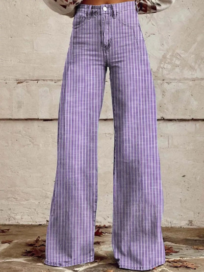 Purple plaid pants worn by a person against a concrete wall.