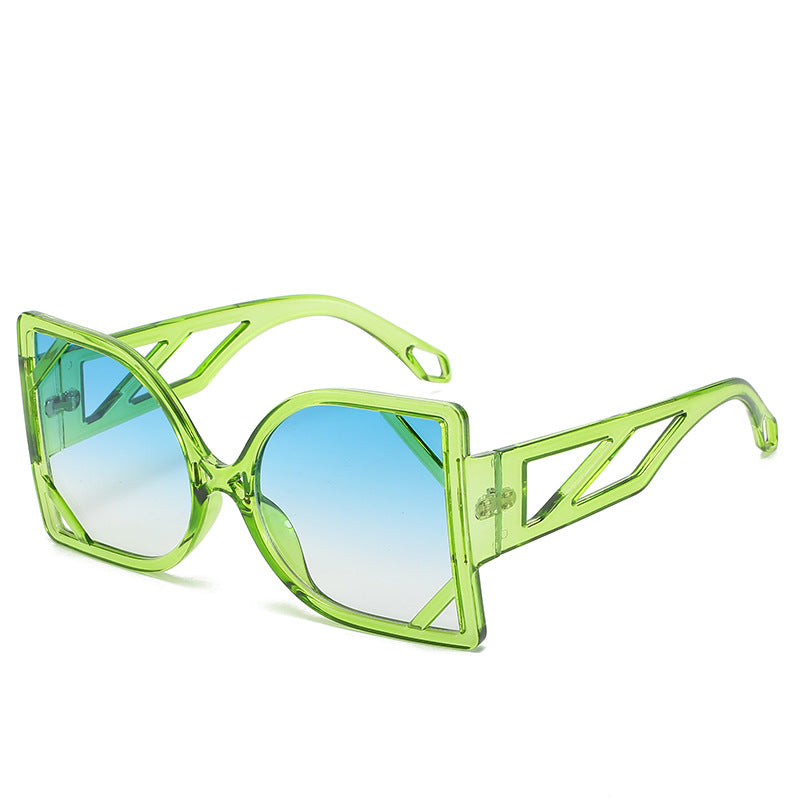 Neon green sunglasses with blue gradient lenses on a white background