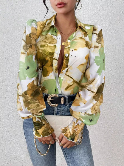 Person wearing a colorful floral shirt with a neutral background