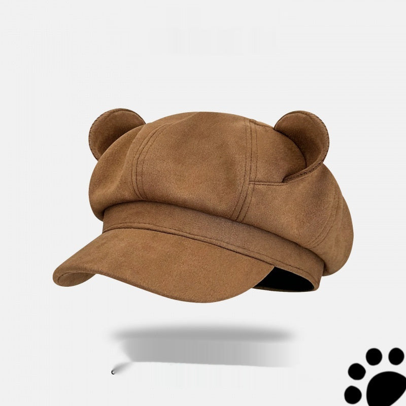 Brown cap with bear ears on a white background