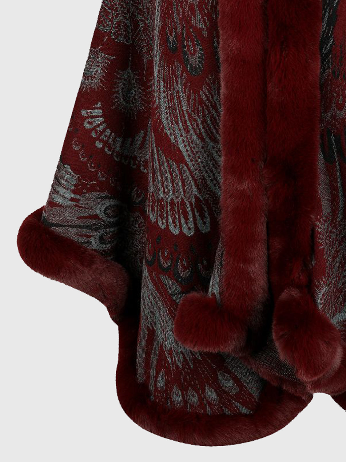 Close-up of a red fur coat with intricate patterns on a white background