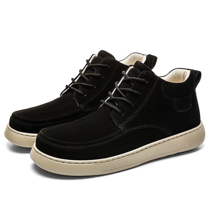 Black high-top sneakers with white soles on a white background