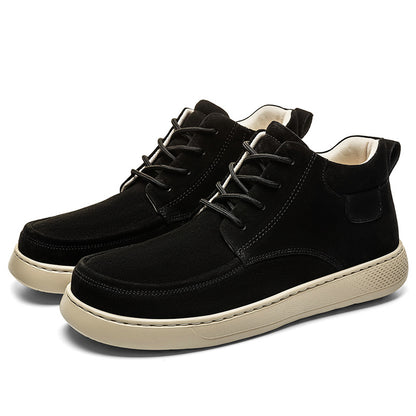 Black high-top sneakers with white soles on a white background