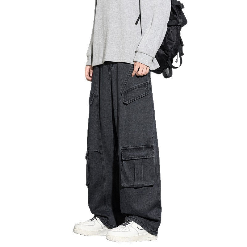 Person wearing black cargo pants with a white background
