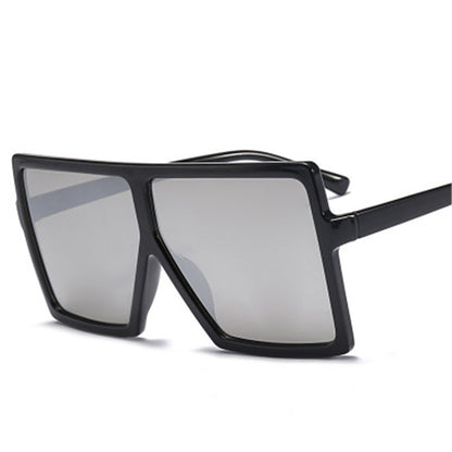 Black sunglasses with reflective lenses on a white background