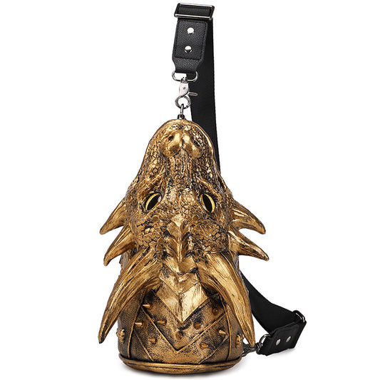 Gold dragon head bag with a black strap on a white background