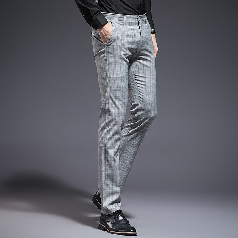 Gray checkered pants worn by a person on a gray background