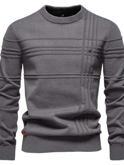 Gray sweater with a subtle pattern on a white background