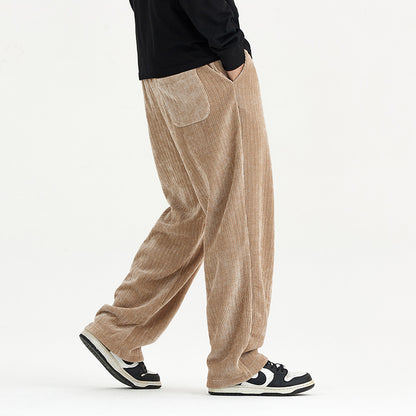 Person wearing beige corduroy pants on a white background