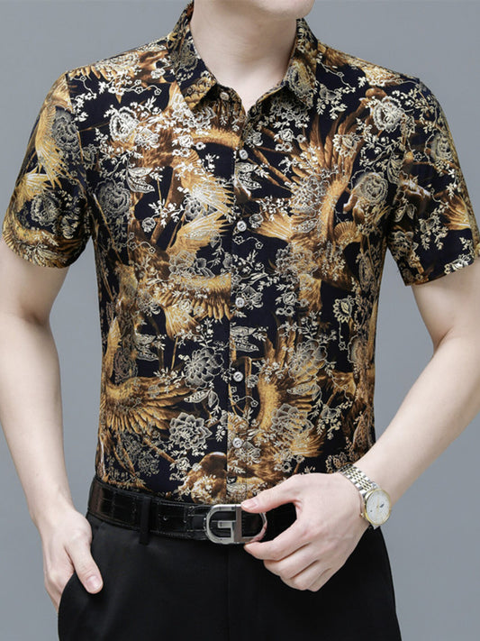 Man wearing a patterned shirt with birds and flowers on a gray background