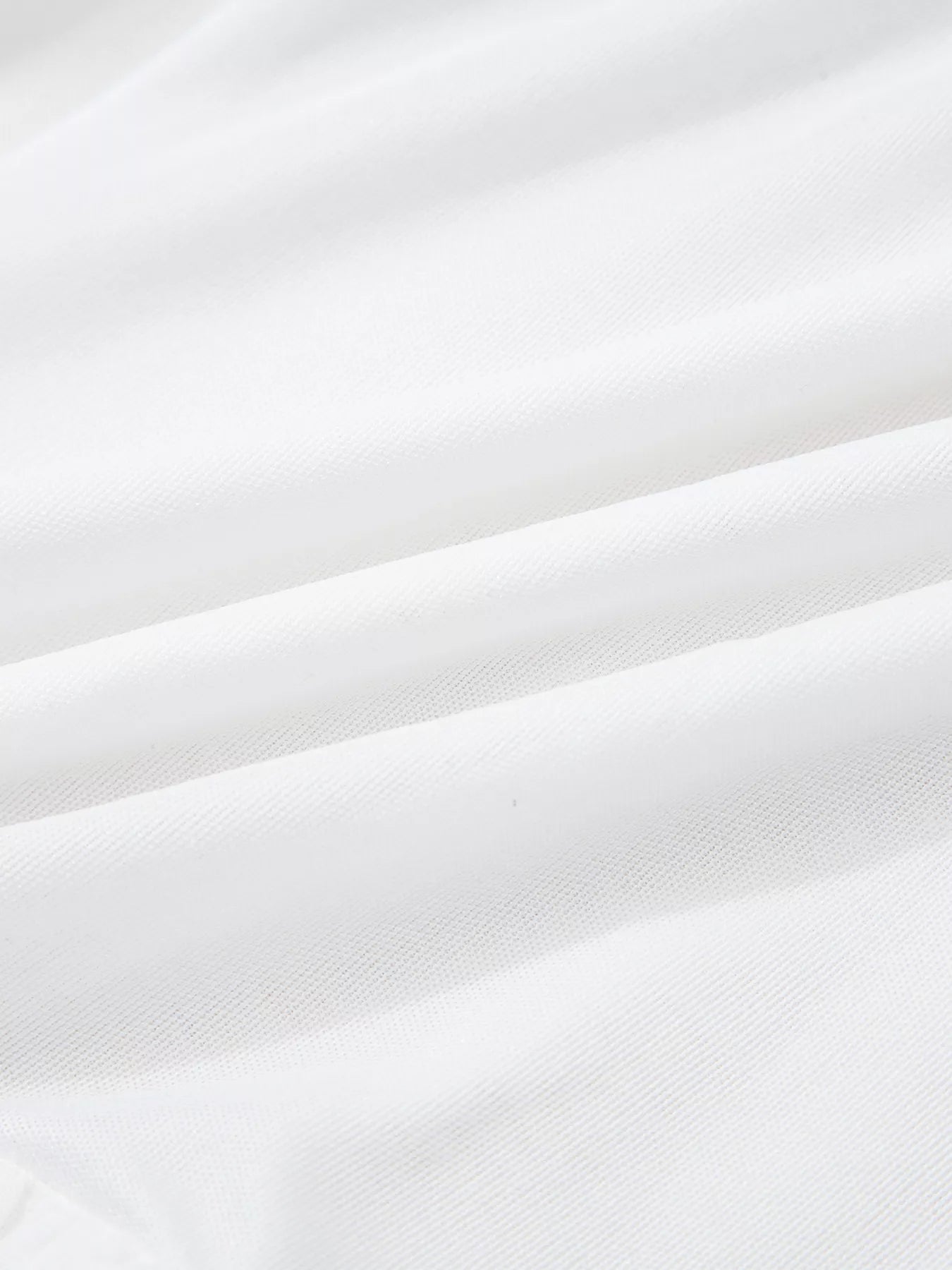 Close-up of white fabric with a subtle texture