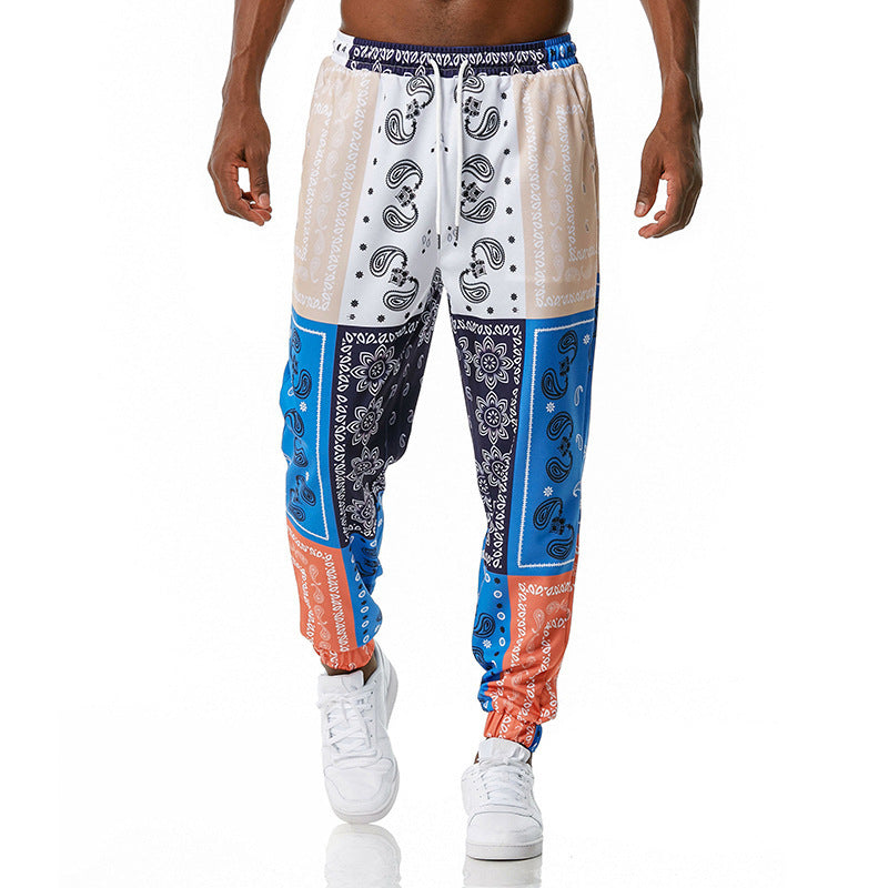Colorful patterned pants worn by a person on a white background
