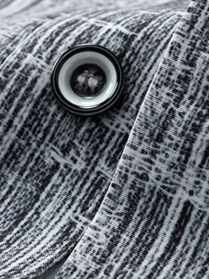 Close-up of a button on a textured fabric surface