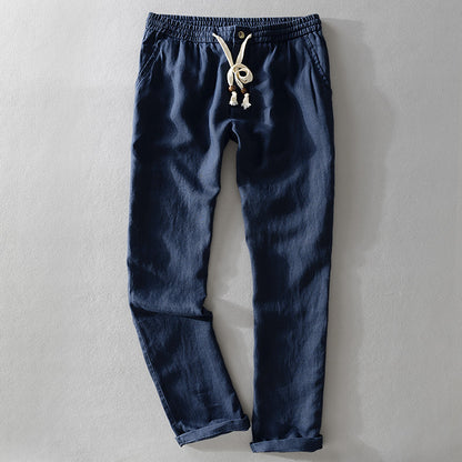 Blue pants with a drawstring on a gray background