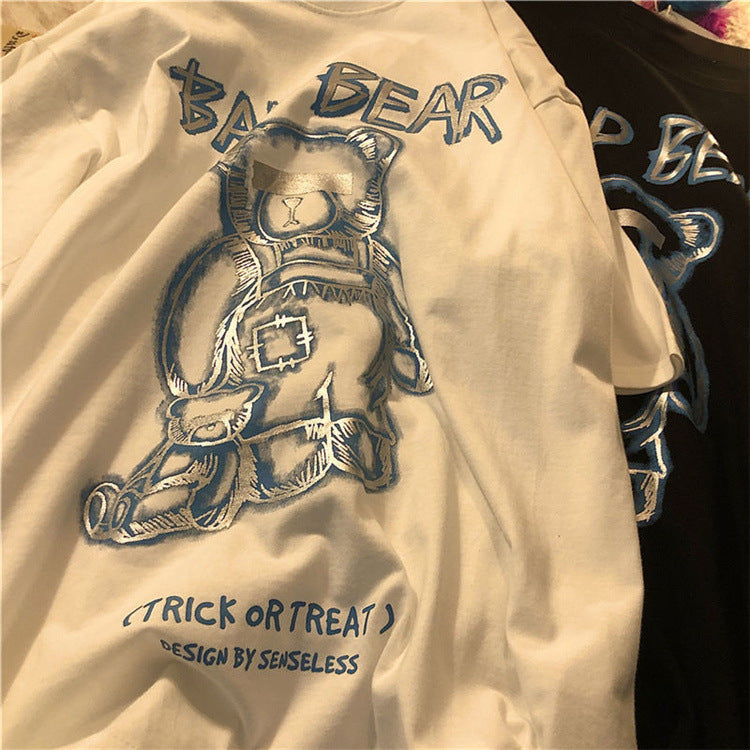 Beige sweatshirt with bear graphic and 'Trick or Treat' text, brand 'BA BEAR' visible.