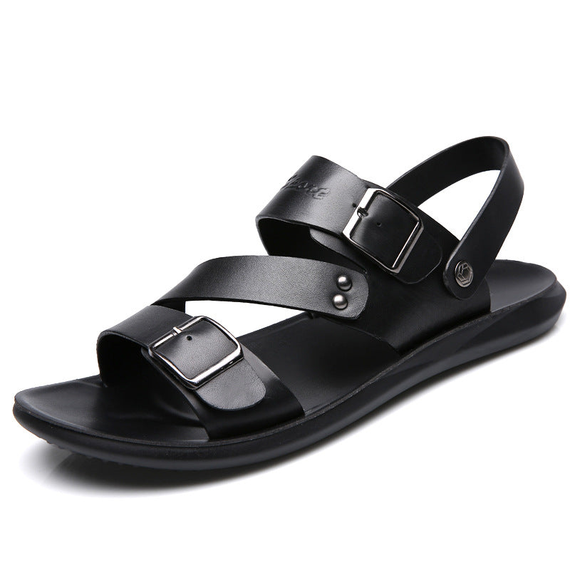 Black sandal with multiple straps and buckles on a white background