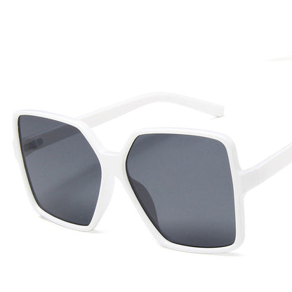 White sunglasses with dark lenses on a white background