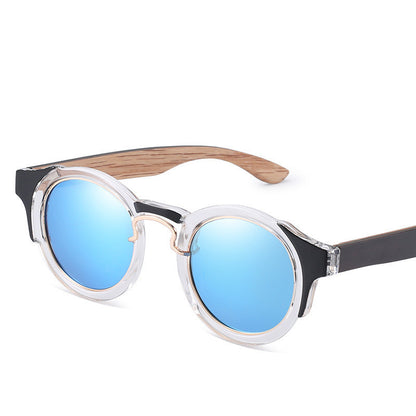 Round sunglasses with blue lenses and wooden frame on a white background