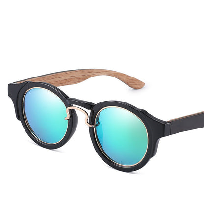 Sunglasses with black frame and wooden arm on a white background