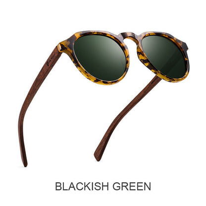 Sunglasses with tortoiseshell frame and dark lenses on a white background