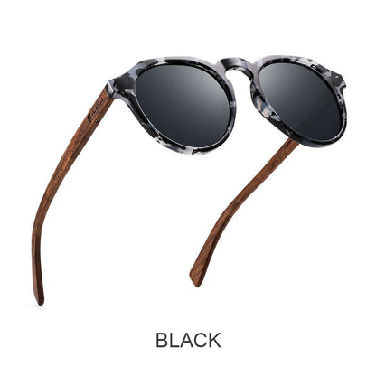 Sunglasses with wooden arms and black lenses on a white background