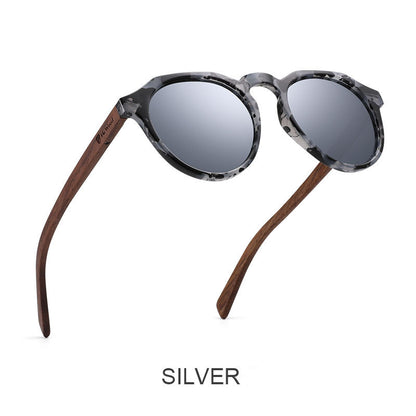 Sunglasses with wooden arms and gray lenses on a white background