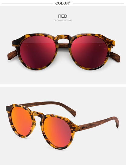 Sunglasses with tortoiseshell frame and red lenses on a white background