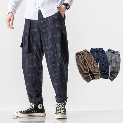 Plaid pants worn by a person on a white background with additional colors shown below.