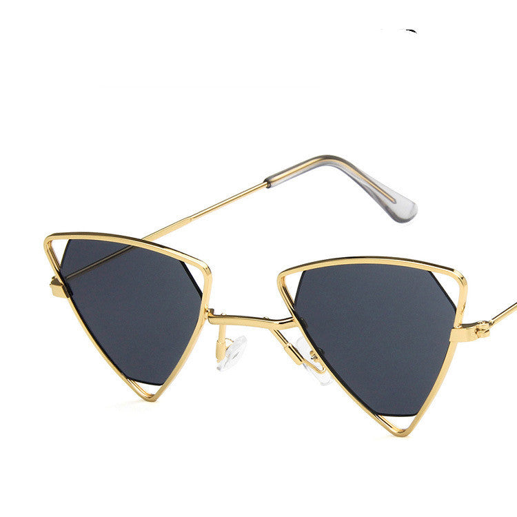 Gold-framed sunglasses with black lenses on a white background