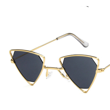 Gold-framed sunglasses with black lenses on a white background