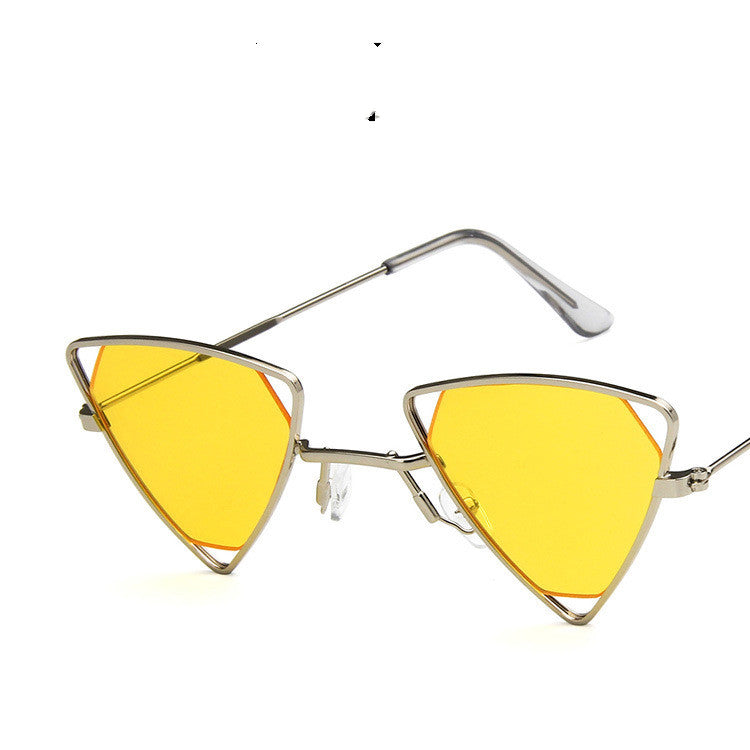 Triangular sunglasses with yellow lenses and gold frames on a white background