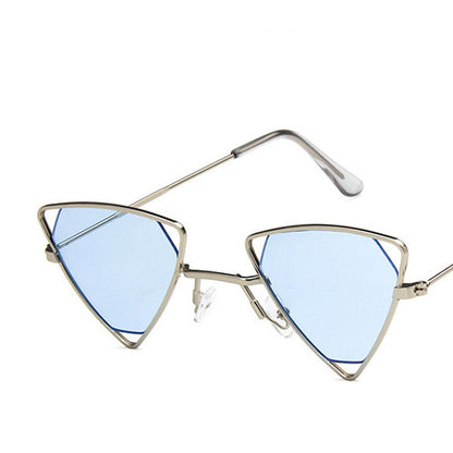 Triangular sunglasses with blue lenses and gold frames on a white background