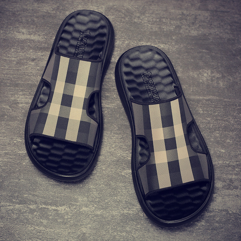 Pair of checkered slides on a gray surface
