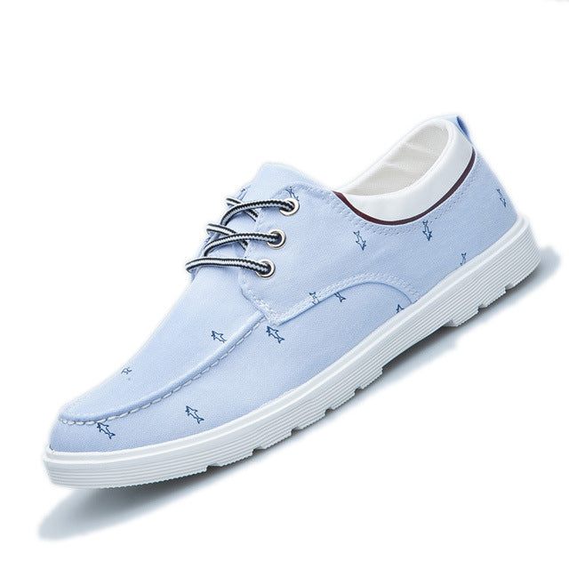Light blue casual shoe with white laces on a white background