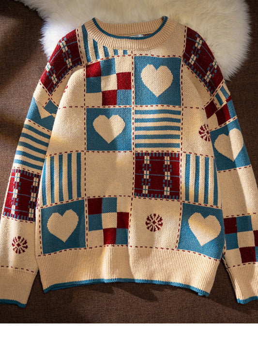 Patchwork sweater with heart patterns on a textured surface
